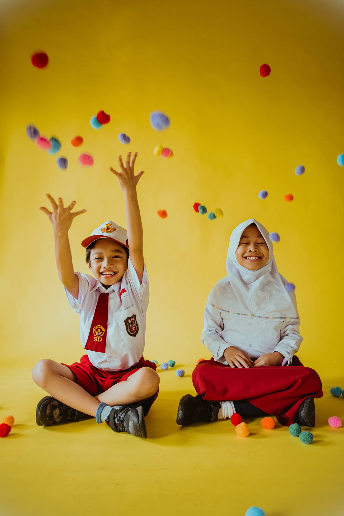 Two Classmates with Falling Balls